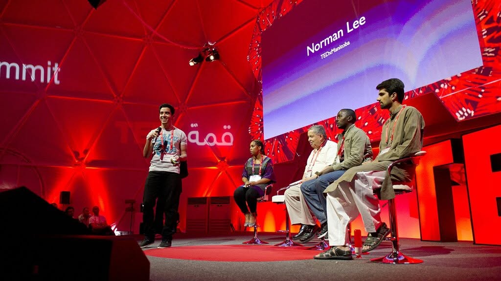 Ahmed Nabawy speaking on stage at TED Summit Doha